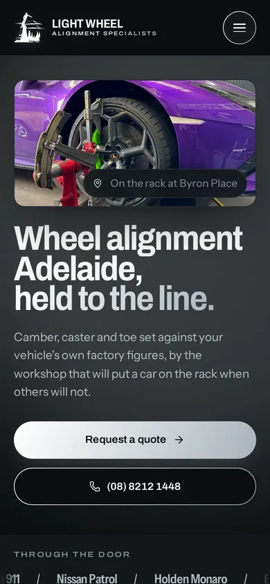 Light Wheel Alignment Specialists website on a phone